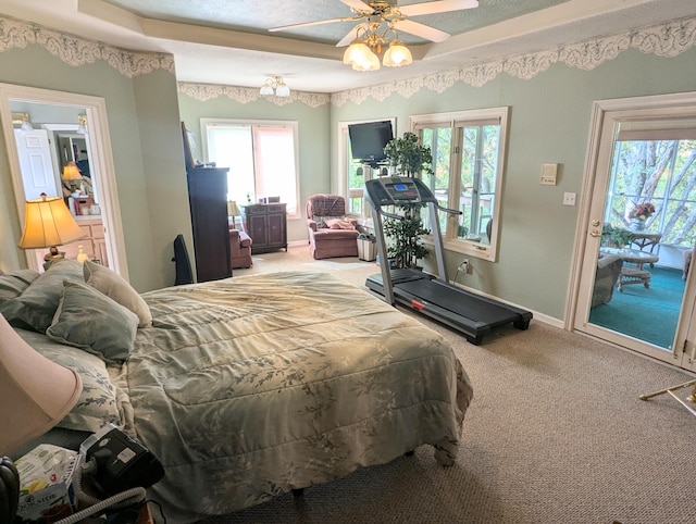 bedroom with access to outside, a textured ceiling, carpet flooring, and ceiling fan