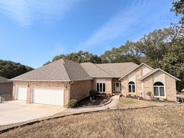 ranch-style house featuring a garage