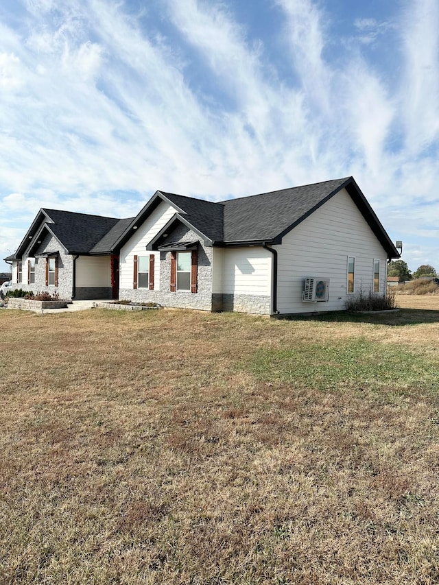 view of home's exterior with a lawn