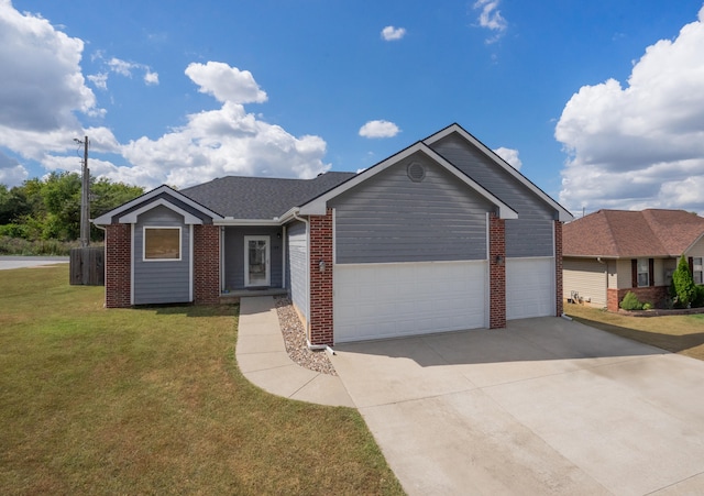 ranch-style home with a front lawn and a garage