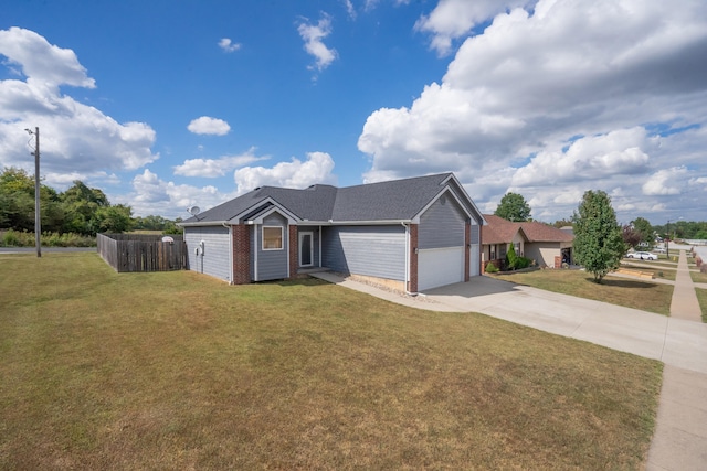 view of front of home featuring a front yard and a garage