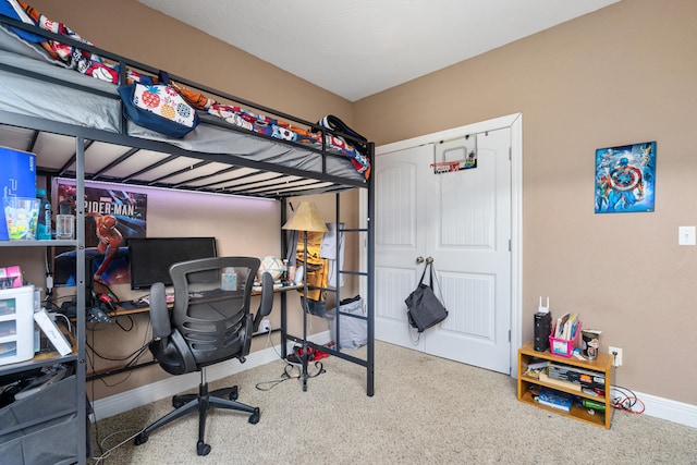 carpeted bedroom with a closet