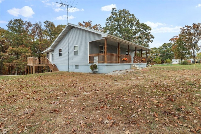 view of home's exterior with a wooden deck