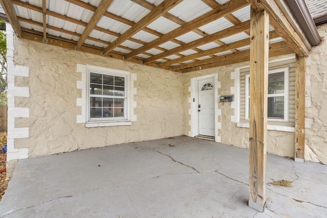 doorway to property with a patio area