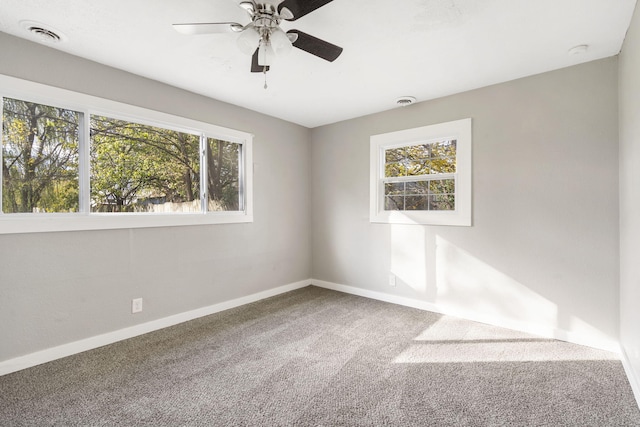 carpeted empty room with ceiling fan