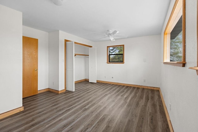 unfurnished bedroom with baseboards, a closet, and wood finished floors