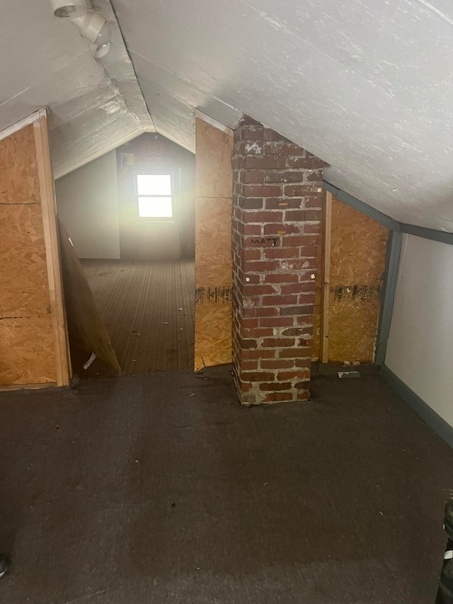 bonus room with vaulted ceiling