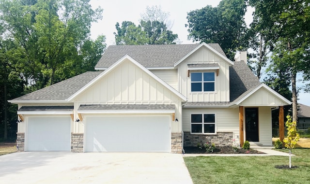 craftsman-style house with a garage and a front yard