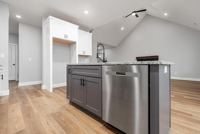 kitchen featuring gray cabinets, white cabinetry, an island with sink, stainless steel dishwasher, and light stone counters