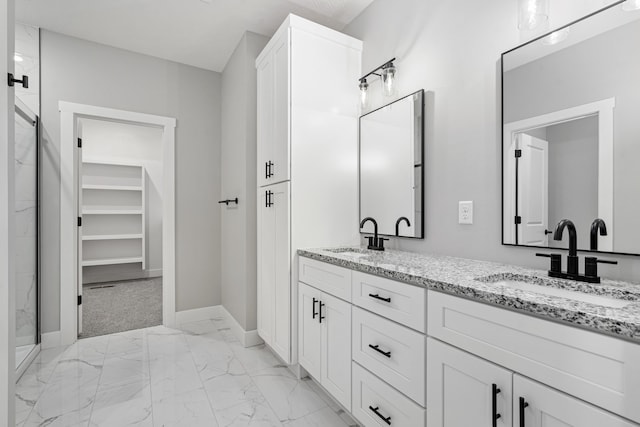 bathroom featuring vanity and a shower