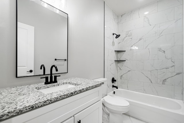 full bathroom featuring vanity, toilet, and tiled shower / bath