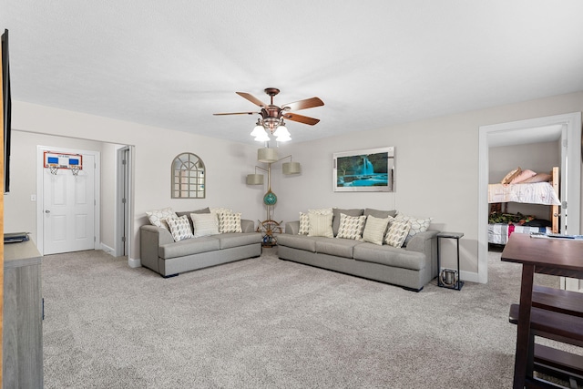 living room featuring light carpet and ceiling fan