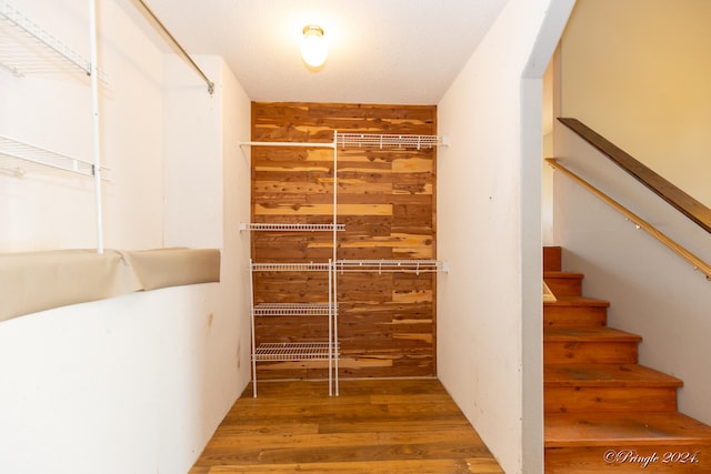 walk in closet featuring hardwood / wood-style flooring