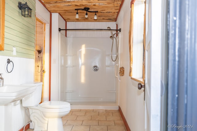 bathroom featuring walk in shower, wooden ceiling, toilet, wooden walls, and tile patterned floors