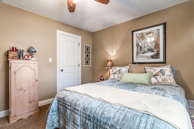 carpeted bedroom with a textured ceiling and ceiling fan