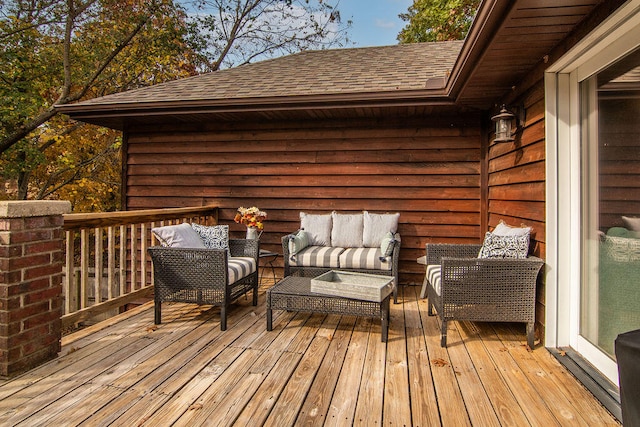 wooden terrace featuring an outdoor hangout area