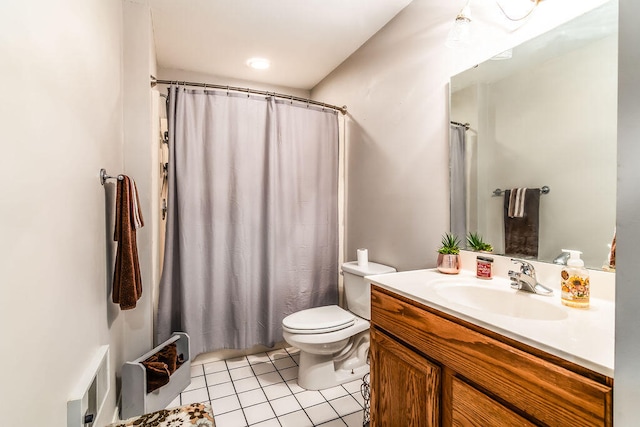 bathroom featuring vanity, a shower with curtain, toilet, and tile patterned floors