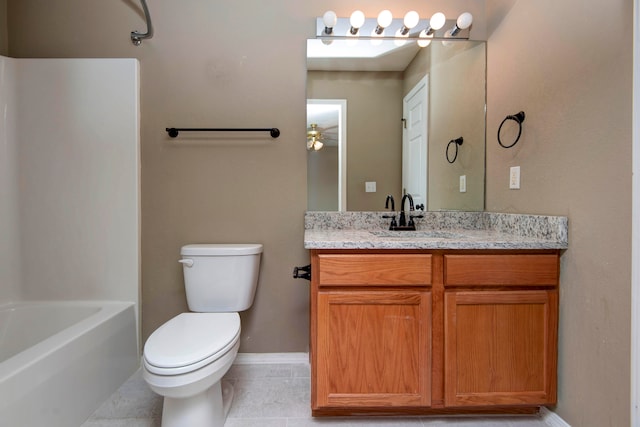 full bathroom featuring vanity, toilet, tile patterned floors, and shower / washtub combination