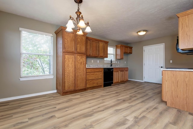 81 Clear Cove Dr, Reeds Spring, MO 65737 - kitchen featuring dishwasher, baseboards, a chandelier, light wood-style floors, and light countertops