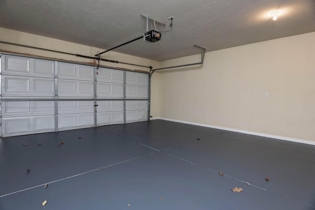 81 Clear Cove Dr, Reeds Spring, MO 65737 - garage with a garage door opener and baseboards