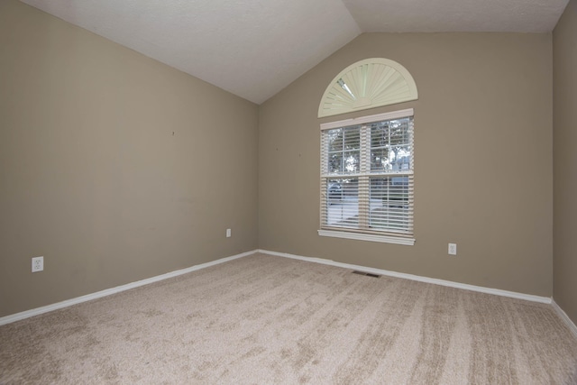 81 Clear Cove Dr, Reeds Spring, MO 65737 - spare room with carpet flooring, lofted ceiling, and baseboards