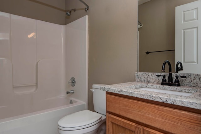 full bathroom with bathtub / shower combination, vanity, and toilet