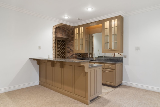 bar with ornamental molding and light carpet