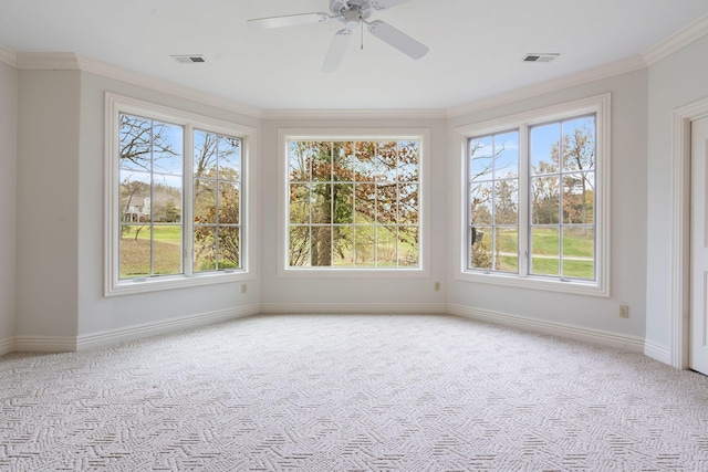 unfurnished sunroom featuring a healthy amount of sunlight and ceiling fan