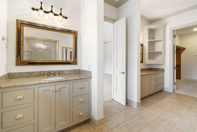 bathroom with vanity, crown molding, and tile patterned flooring