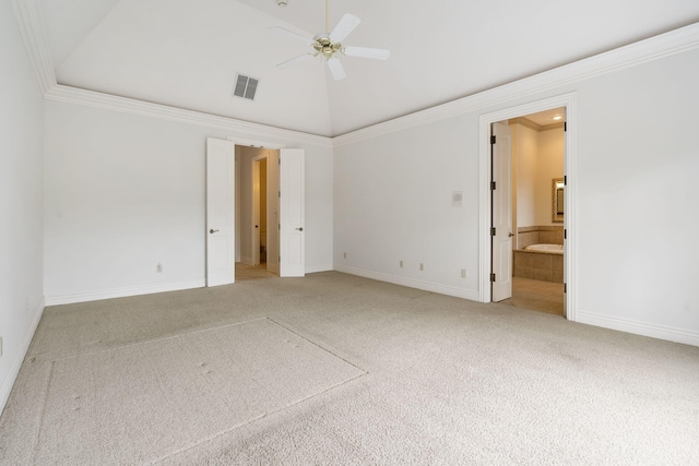 carpeted spare room featuring crown molding and ceiling fan