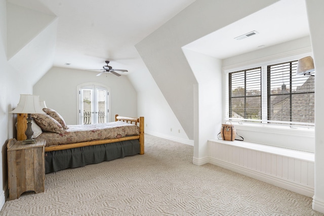 carpeted bedroom featuring vaulted ceiling and ceiling fan