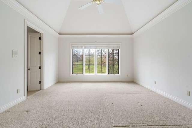 carpeted empty room featuring crown molding, ceiling fan, and vaulted ceiling