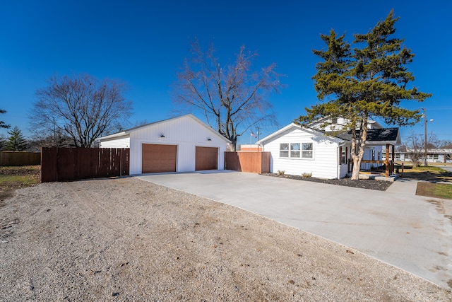 view of home's exterior with an outdoor structure and a garage