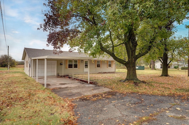 single story home with a front yard and a garage