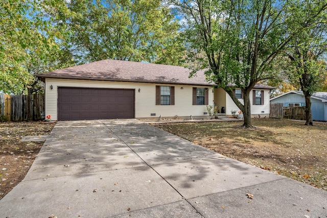 ranch-style home featuring a garage