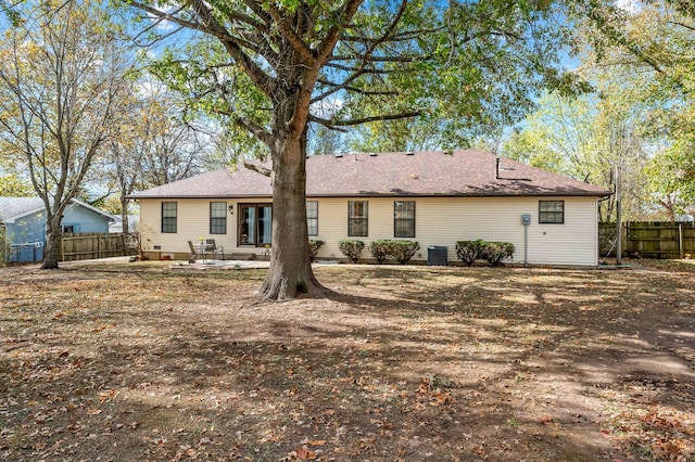 back of property featuring central air condition unit and a patio