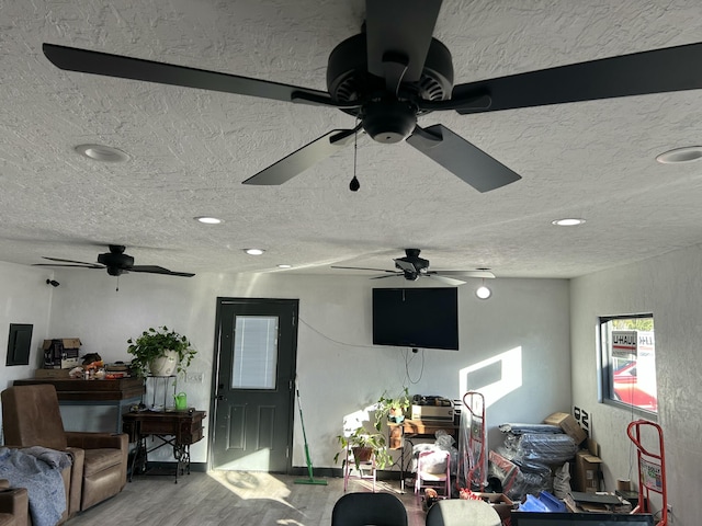20600 Lawrence Unit 2200, Aurora, MO 65605 - living room featuring wood finished floors, ceiling fan, a textured ceiling, and recessed lighting