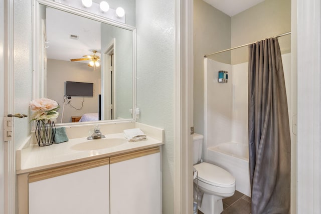 full bathroom with ceiling fan, toilet, shower / bath combo, vanity, and tile patterned flooring