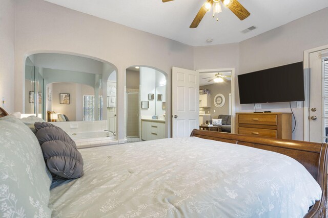 bedroom with ceiling fan and ensuite bath