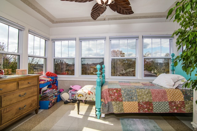 bedroom featuring multiple windows and ceiling fan