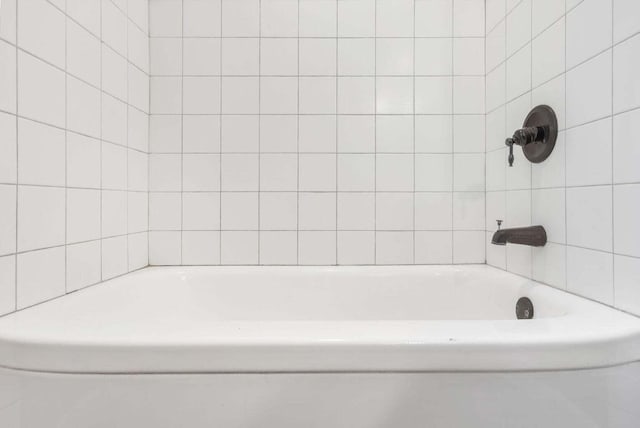 bathroom with a tub to relax in