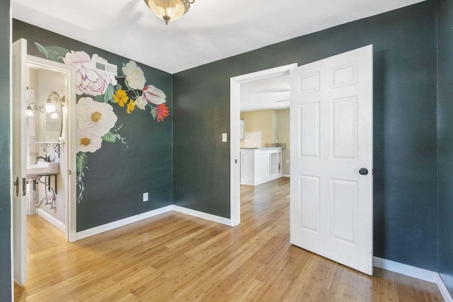 spare room with light wood-type flooring