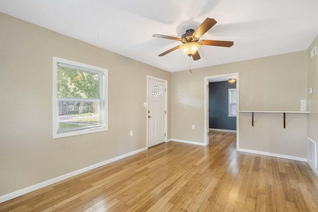 interior space featuring light wood-type flooring and ceiling fan