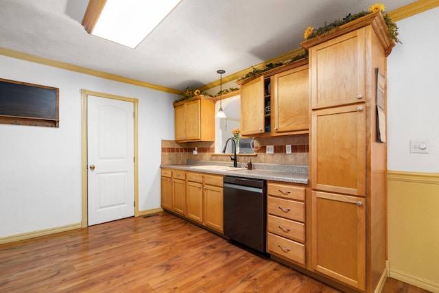 kitchen with hardwood / wood-style flooring, black dishwasher, crown molding, sink, and decorative light fixtures