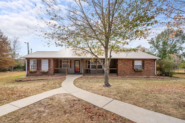 single story home with a front yard and a porch