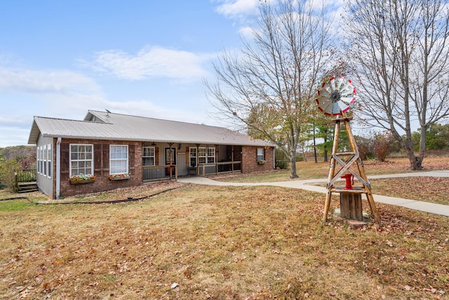 view of front of home with a front yard