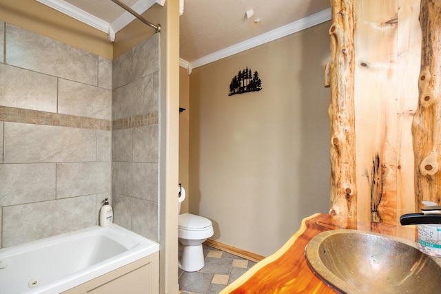 full bathroom with a textured ceiling, toilet, crown molding, tiled shower / bath combo, and sink