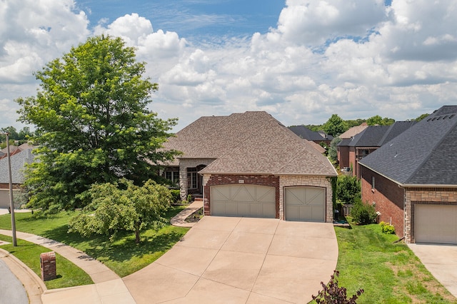 view of front of property with a front lawn and a garage