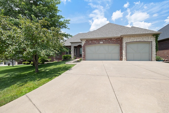 view of front facade with a front yard and a garage