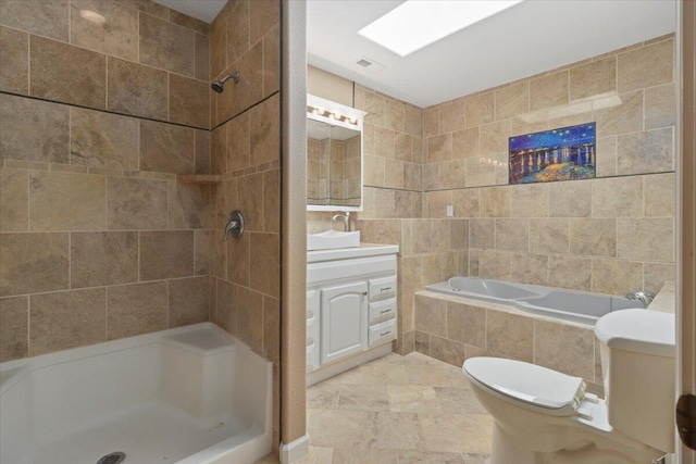 full bathroom featuring vanity, toilet, tile walls, and plus walk in shower